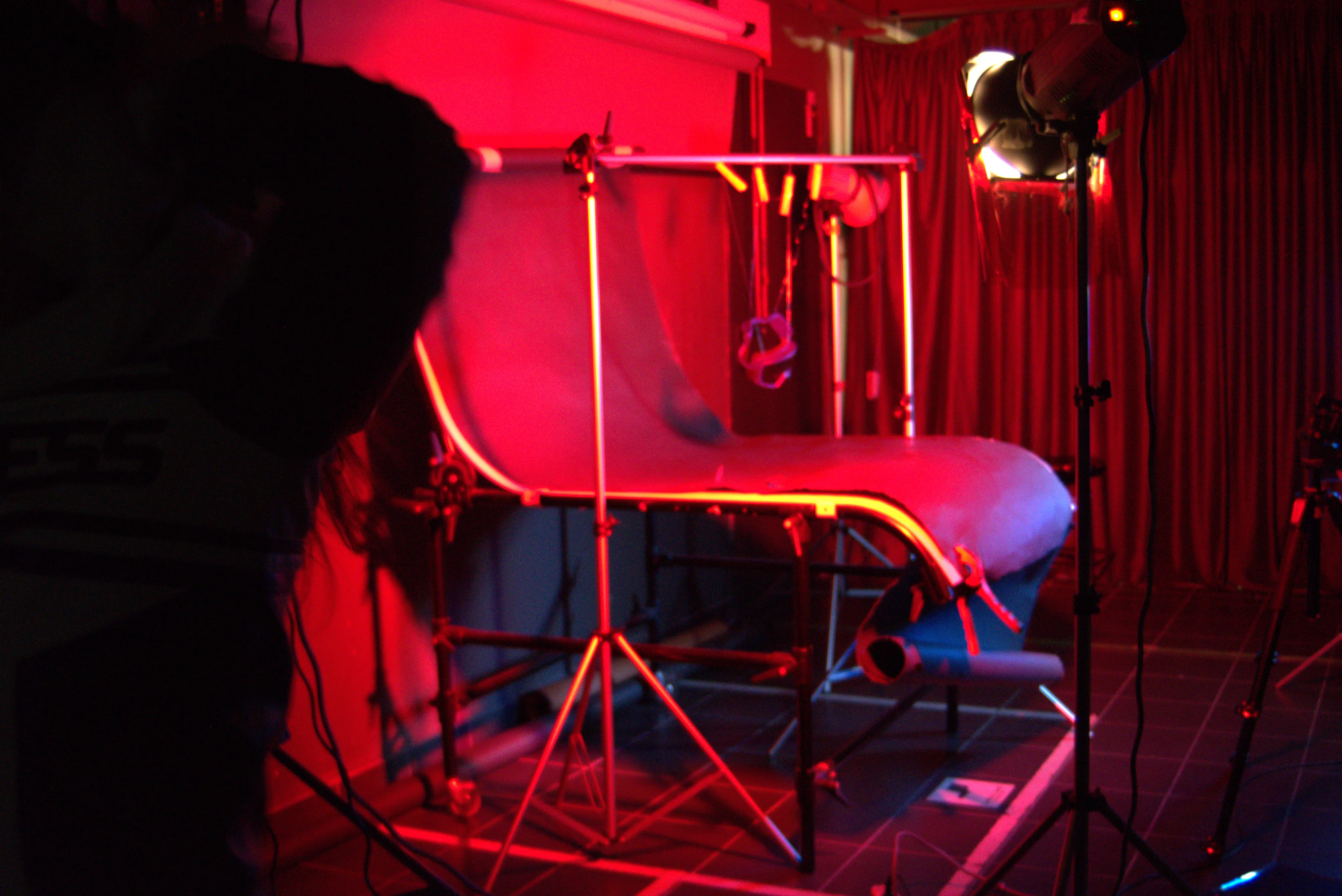 Behind the scenes — the goggles lit on a red studio set