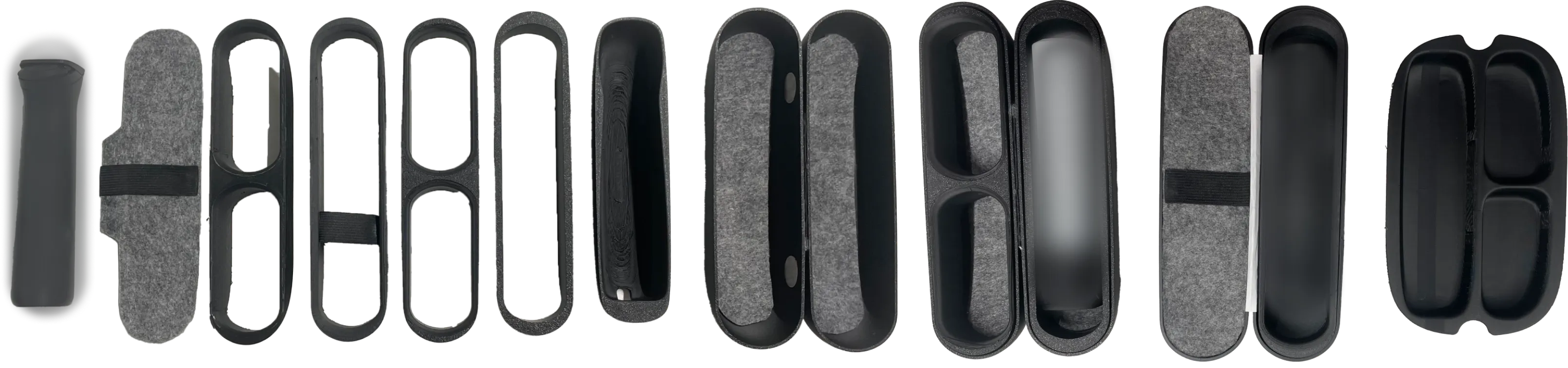 A lineup of 3D-printed travel-case prototypes, from early forms to refined shells